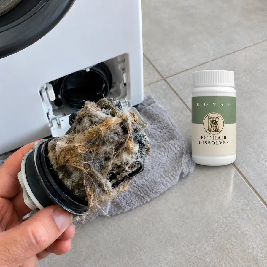 A washing machine filter full of pet hair next to a jar of Kovah