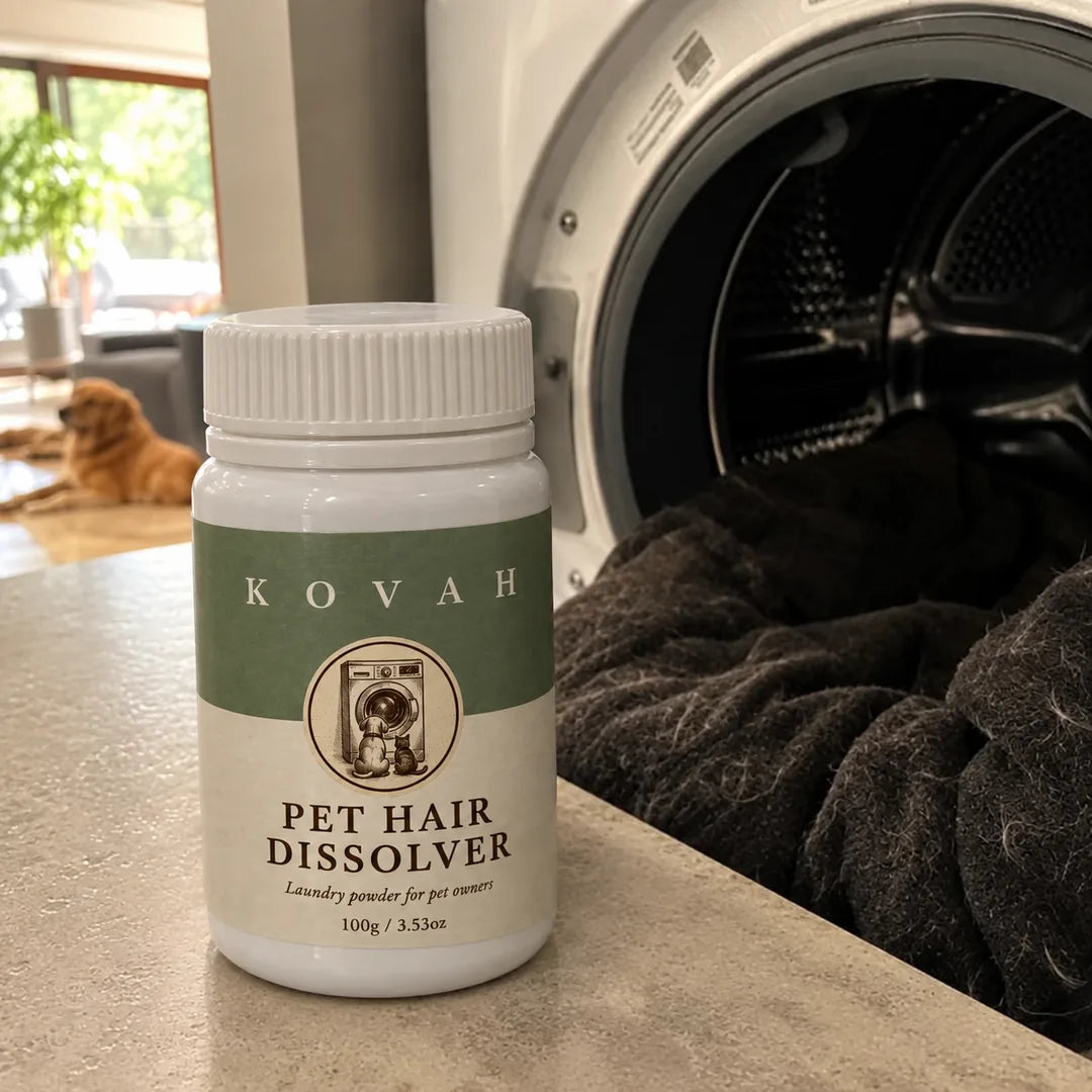 A jar of Kovah Pet Hair Dissolver next to an open washing machine full of pet blankets